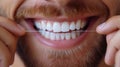 Man Flossing Teeth Close-up