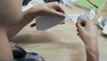 Close-up of man folding origami paper. Stock footage. Men`s hands are folded from white paper origami or airplane Royalty Free Stock Photo