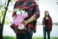 Close-up of a man giving happy woman flowers.A picture of a romantic couple Royalty Free Stock Photo