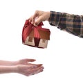 Close-up of man giving wooden house model tied with a bow to wom Royalty Free Stock Photo