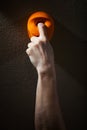 Close up of man gripping handhold with one finger