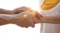 Close up of Man hand as Lending a helping hand as trust together with compassion concept as lens flare scene at park Royalty Free Stock Photo