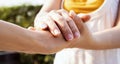 Close up of Man hand as Lending a helping hand as trust together with compassion concept scene at park Royalty Free Stock Photo