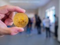 Close-up of man hand holding a gold coin bitcoin coin Royalty Free Stock Photo
