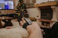 Close-up of man hand holding TV remote control Royalty Free Stock Photo
