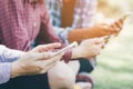 Close up of a man hand holding using mobile smart phone outdoor cell phone Royalty Free Stock Photo