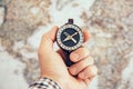 Close up of man hand holding vintage compass with world map as background. Travel and Business planning concept Royalty Free Stock Photo