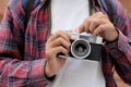 Close up of man hand holding vintage film camera, Tourist, traveller taking photo by vintage camera on vacation Royalty Free Stock Photo