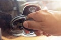 Close up man hand inserting a key into the door lock  a car Royalty Free Stock Photo