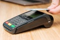 Close up man hand paying with contactless credit card with NFC technology using wireless payment terminal. Cashless Royalty Free Stock Photo