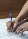 Close up of Man hand with pen writing and signing Royalty Free Stock Photo