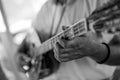 Close up of man hand playing bouzouki