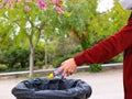 Close up of man hand putting  bottle of a plastic reuse for recycling concept environmental protection world recycle in park Royalty Free Stock Photo