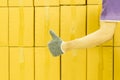 Close-up of man hand with thumb up in front of cardboard boxes, likes or approves concept Royalty Free Stock Photo