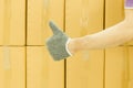 Close-up of man hand with thumb up in front of cardboard boxes, likes or approves concept Royalty Free Stock Photo