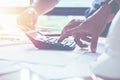 Close up man hand using calculator Calculating bonusOr other compensation to employees to increase productivity.Writing paper on Royalty Free Stock Photo