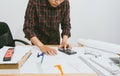 Close up man hand using calculator Calculating bonusOr other compensation to employees to increase productivity. Royalty Free Stock Photo