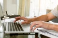 Close up man hand using laptop for work at home. Student hand doing his homework with laptop Royalty Free Stock Photo