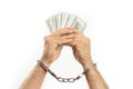 Close-up of man in handcuffs showing money as illegal concept Royalty Free Stock Photo