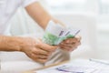 Close up of man hands counting money at home Royalty Free Stock Photo