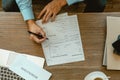 Close up man hands is filling out a job application form. Unemployed concept Royalty Free Stock Photo