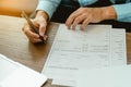 Close up man hands is filling out a job application form. Unemployed concept Royalty Free Stock Photo