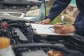 Close up Man hands fixing Car machinery vehicle mechanical service. Mechanic man hands repairing car auto repair shop. open Royalty Free Stock Photo