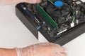 Close up of man hands with gloves installing Ram DDR4 memory mod Royalty Free Stock Photo