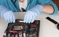 Close up of man hands with gloves installing Ram DDR4 memory mod Royalty Free Stock Photo