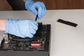 Close up of man hands with gloves installing Ram DDR4 memory mod Royalty Free Stock Photo