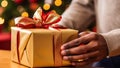 Close-up of man hands holding gift box on Christmas background Royalty Free Stock Photo