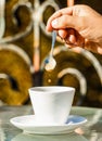 Close up of a man hands holding a hot coffe cups. Closeup. Coffe time, spoon. Black coffee. Hand of man hold coffee Royalty Free Stock Photo