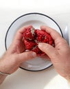 Top view of man hands holding a partially peeled pomegranate Royalty Free Stock Photo