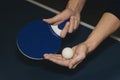 Close up of a man hands holding table tennis rocket and ball Royalty Free Stock Photo
