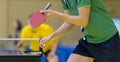 Close up of a man hands holding table tennis rocket and ball Royalty Free Stock Photo