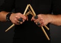 Man hands with broken drumsticks over black Royalty Free Stock Photo