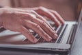 Close-up of man hands and laptop keyboard. Man working or playing on a laptop Royalty Free Stock Photo