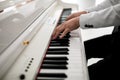Close up of man hands piano playing. Male pianist hands on grand piano keyboard