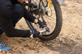 Close up of man hands pumping bicycle wheel, home maintenance of bike, bicycle service and maintaining for new season, faceless