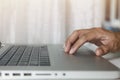 Close up Man hands use touch pad on laptop working at home. Hands touch touch pad use internet for cloud data social network media Royalty Free Stock Photo