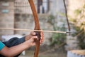 Close Up of Man Helping a Child to Shoot with Arc at Medieval Village Festival