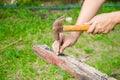 Close up of man hitting nail by hammer Royalty Free Stock Photo