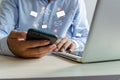 Close-up man holding a cell phone an icon email message. Marketing business sending information to customers or hacking online Royalty Free Stock Photo