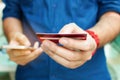 Close up man holding credit card and use smart phone with shopping online. Online payment concept. Royalty Free Stock Photo