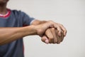 Close-up of a man holding his hand due to nerve endings