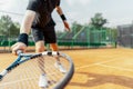 Close up of man holding racket at right hand and beating a tennis ball. Royalty Free Stock Photo