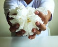 Close up a man holding white tissue for using for cleaning in the room. Royalty Free Stock Photo