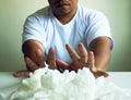 Close up a man holding white tissue for using for cleaning. Royalty Free Stock Photo