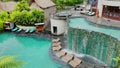 Close up of a man in a infinity swimming pool, rests and he looks out over the edge of pool. Infinity Pool with water Royalty Free Stock Photo