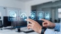 Close-up of a man interacting with holographic interface icons including AI chatbot, cloud upload, cybersecurity, brain, and Royalty Free Stock Photo